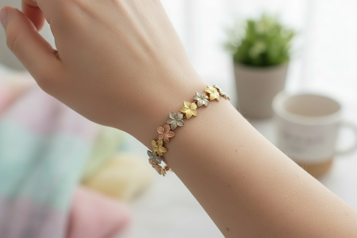 14k tri-color flower bracelet on woman's wrist